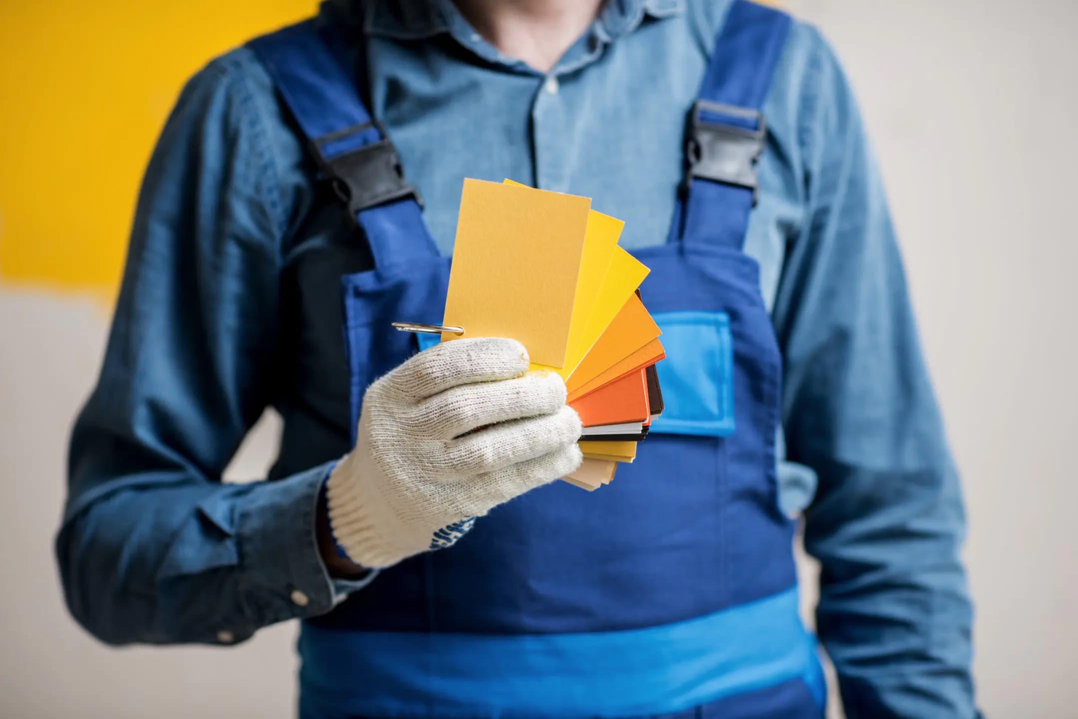 Decorator holding colour swatches
